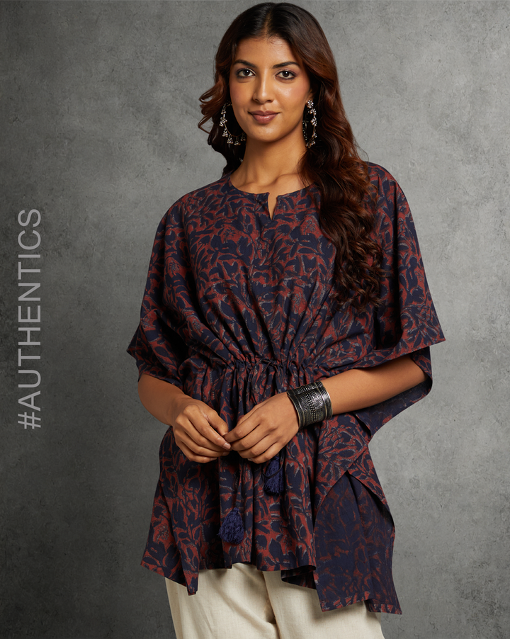 Stylish Dabu printed Navy and Maroon color cotton kaftan, worn by a woman standing in the image.
