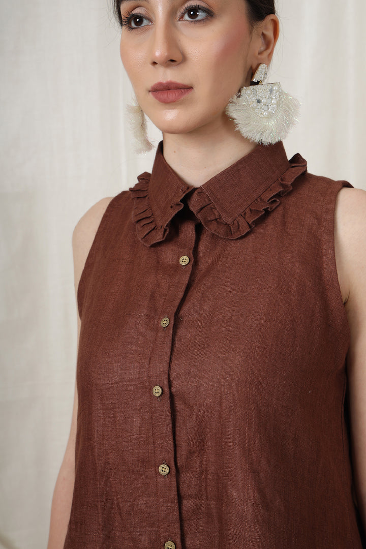 Close-up of fringes and golden coins on the top hem of the co-ord set