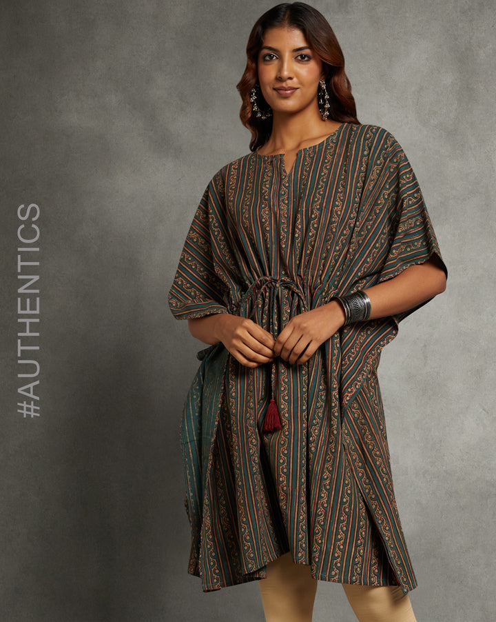 Stylish Dabu printed bottle green cotton kaftan, worn by a woman standing in the image.