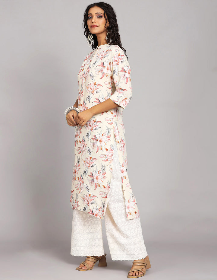 Side profile of a Cream Yellow Long Kurti with Collar Neck Design with three-quarter sleeve paired with white palazzo and brown sandals, showcasing the kurti's length and the smooth drape over the body