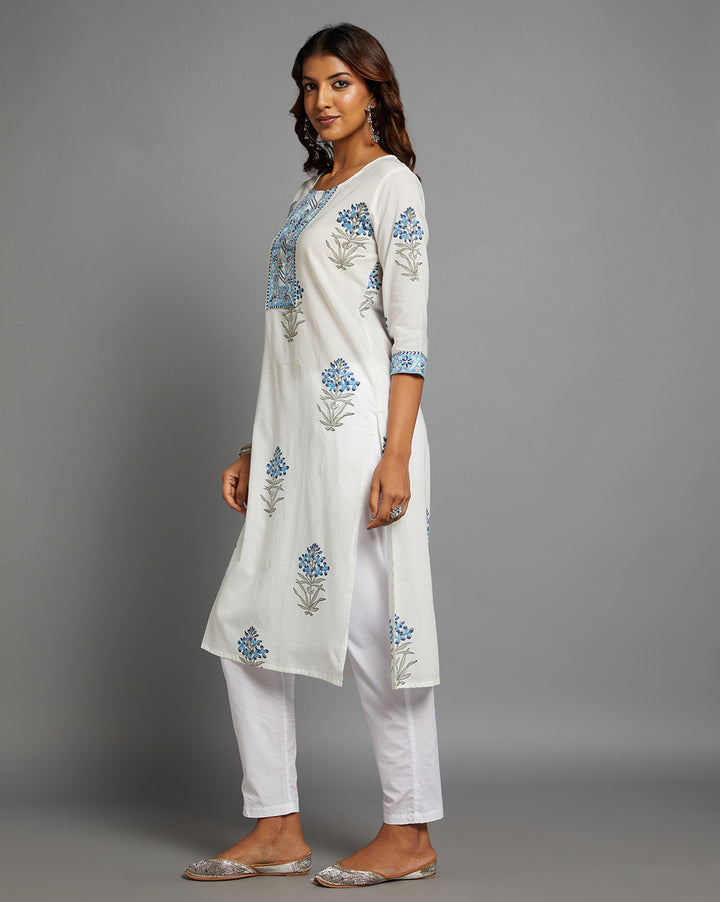 Side profile of a White Round Neck Hand Block Cotton Kurti with three-quarter sleeve paired with white pant, showcasing the kurti's length and the smooth drape over the body