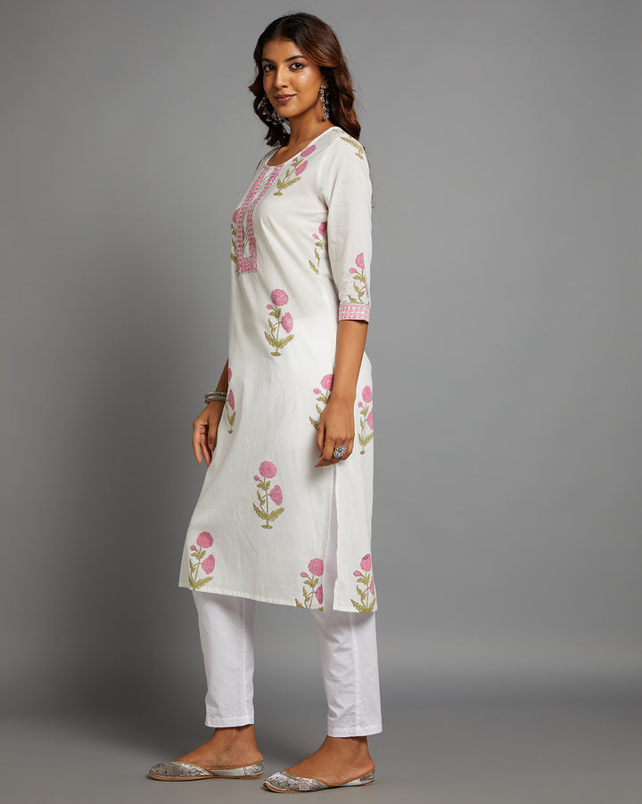 Side profile of a  White Round Neck and Hand Block floral print Cotton Kurti  with three-quarter sleeve paired with white pant  , showcasing the kurti's length and the smooth drape over the body