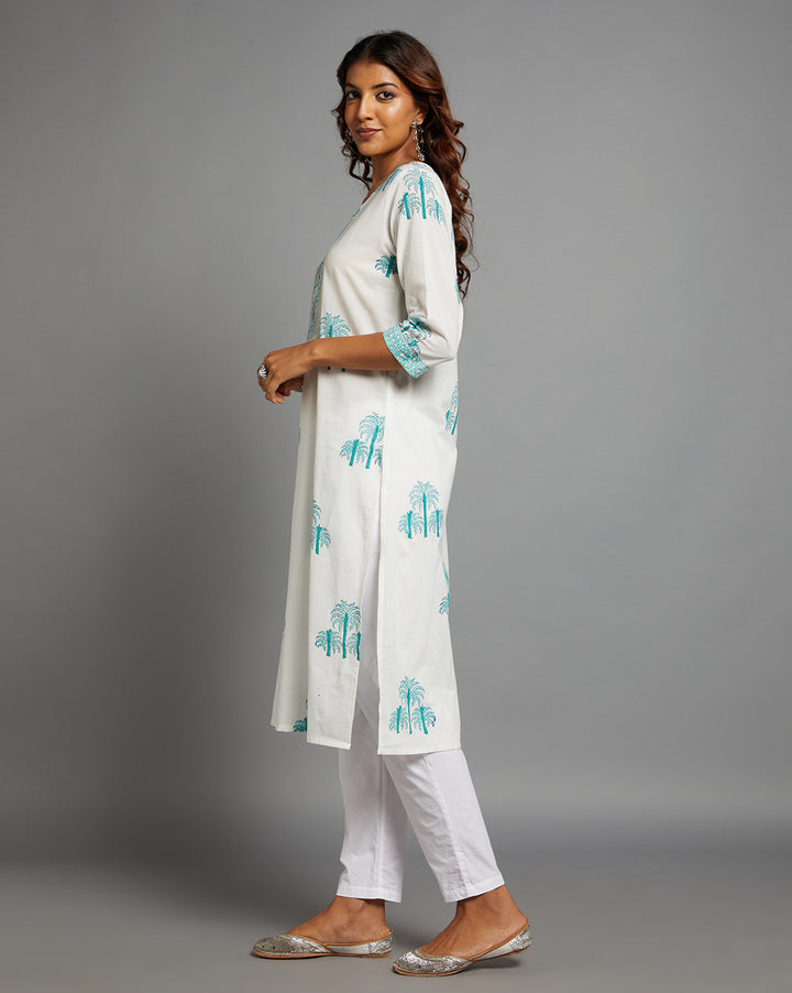 Side profile of a White Round Neck Hand Block Cotton Kurti with three-quarter sleeve paired with white pant, showcasing the kurti's length and the smooth drape over the body