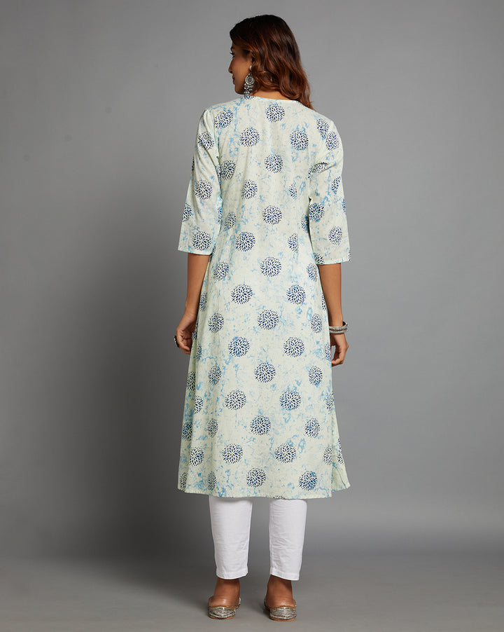 Woman showing the back view of White and blue Cotton A-Line Kurti with Round Neck with three-quarter sleeve paired with white pant and jutti, highlighting the relaxed fit and simple design from behind.