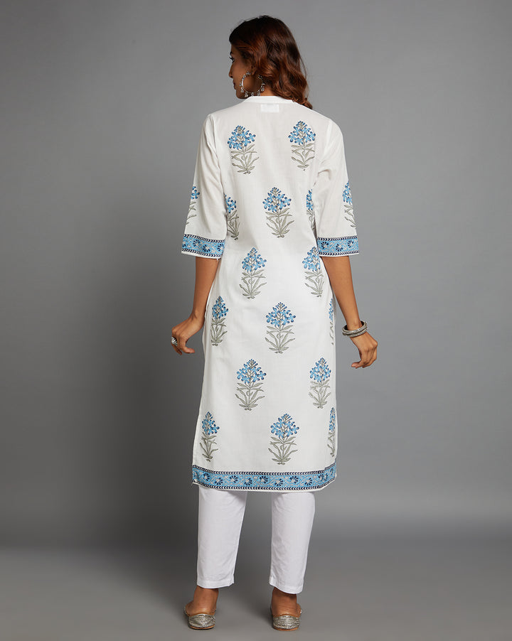 
Woman showing the back view of White Cotton Straight Kurta with Chinese Collar and V-Neck with three-quarter sleeve paired with white pant and jutti, highlighting the relaxed fit and simple design from behind.
