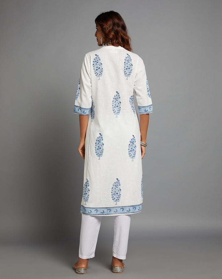 Woman showing the back view of a White linen Straight Kurta with Chinese Collar and V-Neck with three-quarter sleeve paired with white pant and jutti, highlighting the relaxed fit and simple design from behind.