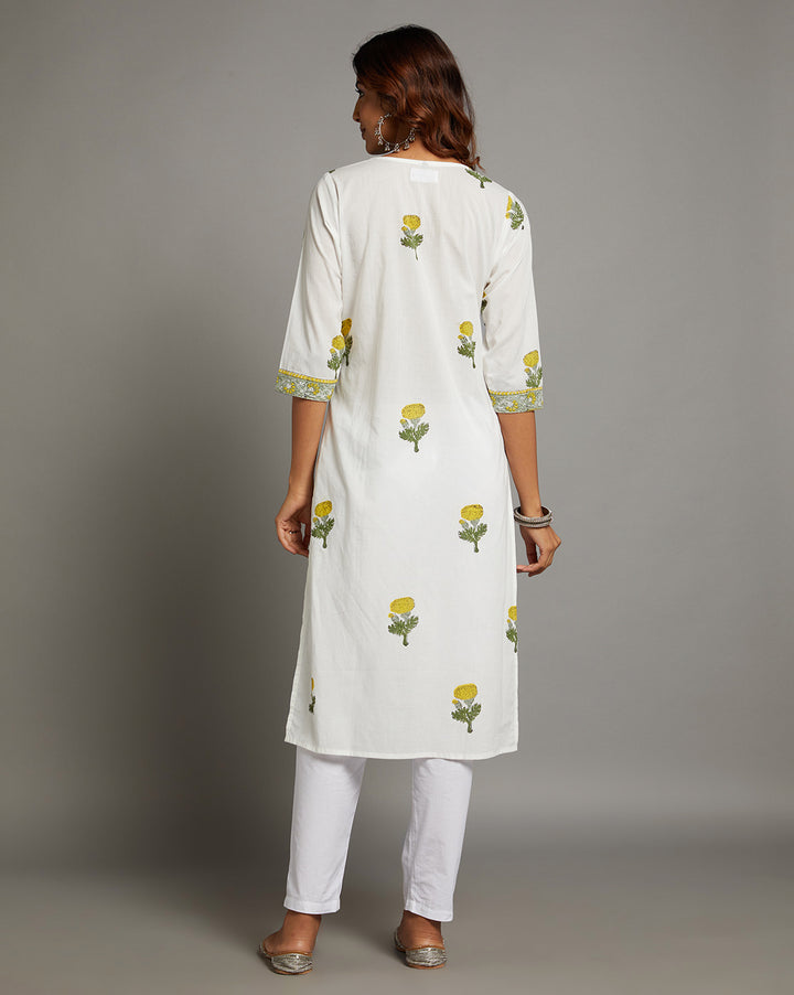 Woman showing the back view of White Cotton Straight Kurta with Chinese Collar and V-Neck with three-quarter sleeve paired with white pant and jutti, highlighting the relaxed fit and simple design from behind.