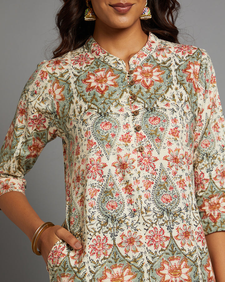 Close-up view of Yellow color floral print kurti, focusing on the fabric texture,Wooden Buttons, neckline and stitching details.
