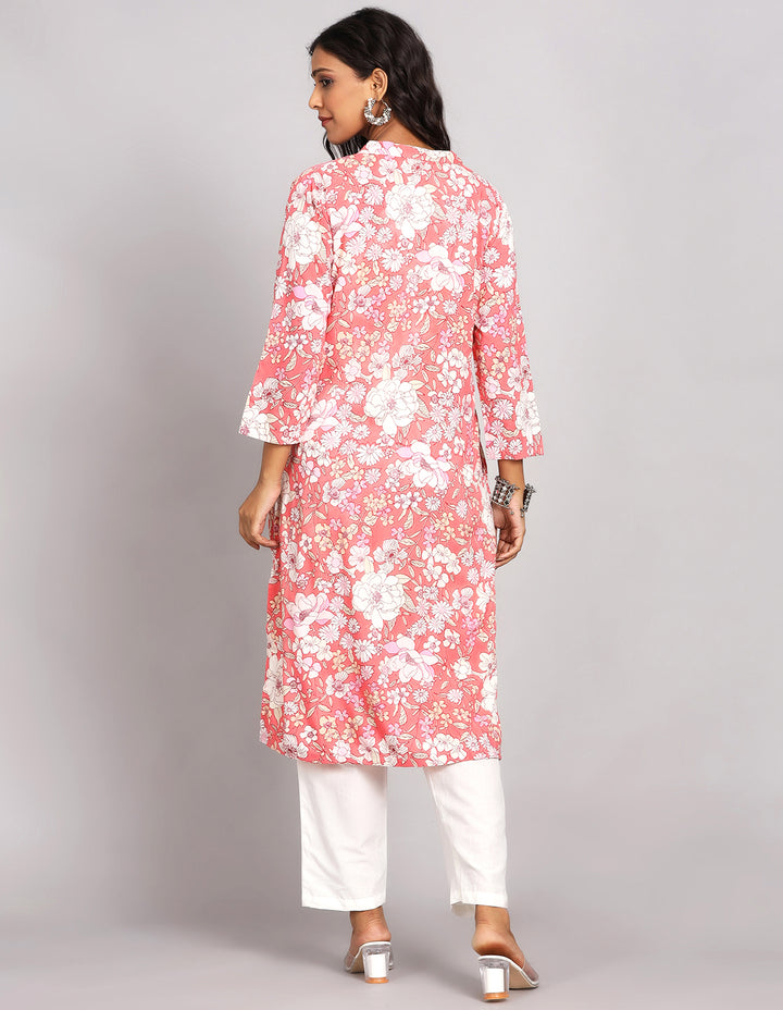 Woman showing the back view of Peach Pink Long Kurti with Collar Neck Line with white pant and white transparent sandals, highlighting the relaxed fit and simple design from behind.