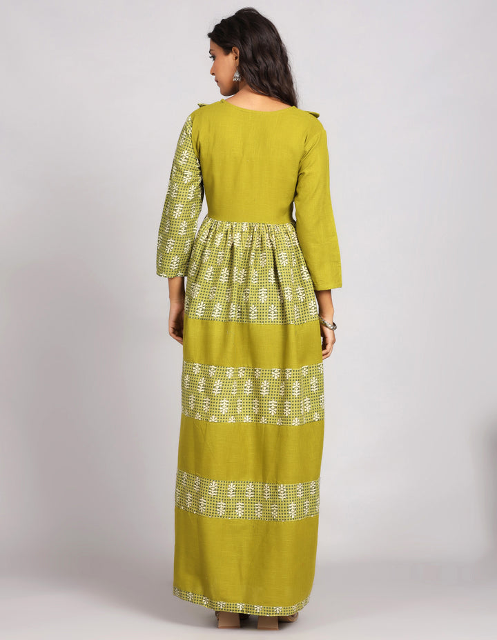 Woman showing the back view of a Printed Mehendi Green with Round Neck Long Kurti and three-fourth sleeves paired with brown sandals, highlighting the relaxed fit and simple design from behind.