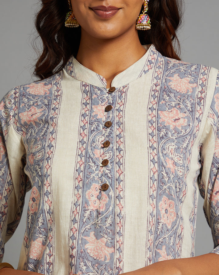 Close-up view of Stylish off white kurti with collar neck and wooden button design , focusing on the fabric texture, neckline and stitching details.
