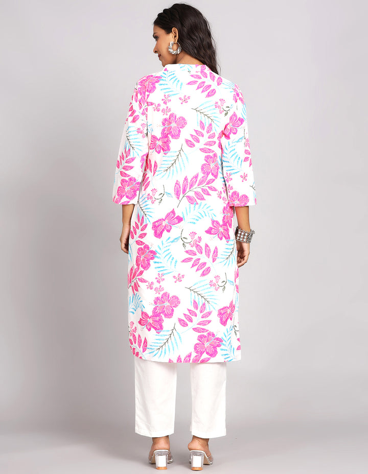 Woman showing the back view of a White Long Kurti With Floral print with three-quarter sleeve paired with white payjama and white transparent heals, highlighting the relaxed fit and simple design from behind.