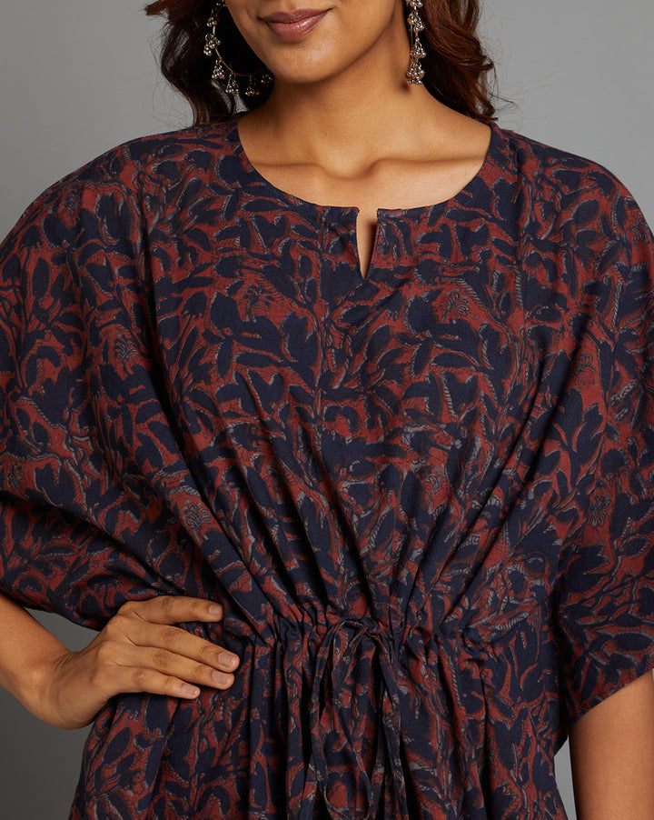 Close-up view of Dabu printed Navy and Maroon color cotton kaftan, focusing on the fabric texture, neckline and stitching details.