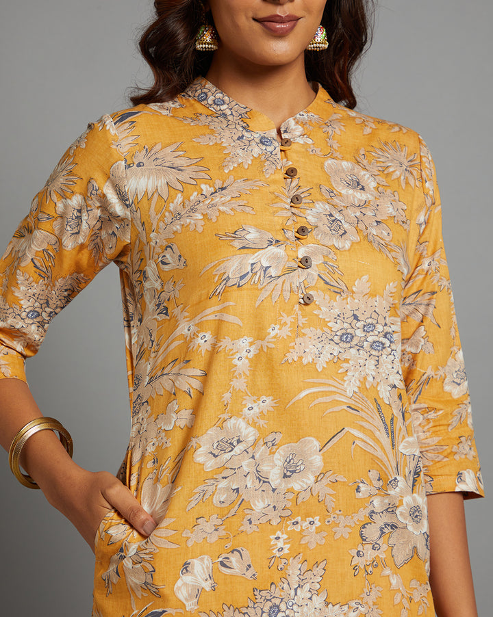 Close-up view of Yellow Collar Neck Hand Block Cotton Kurti, focusing on the fabric texture, neckline and stitching details.
