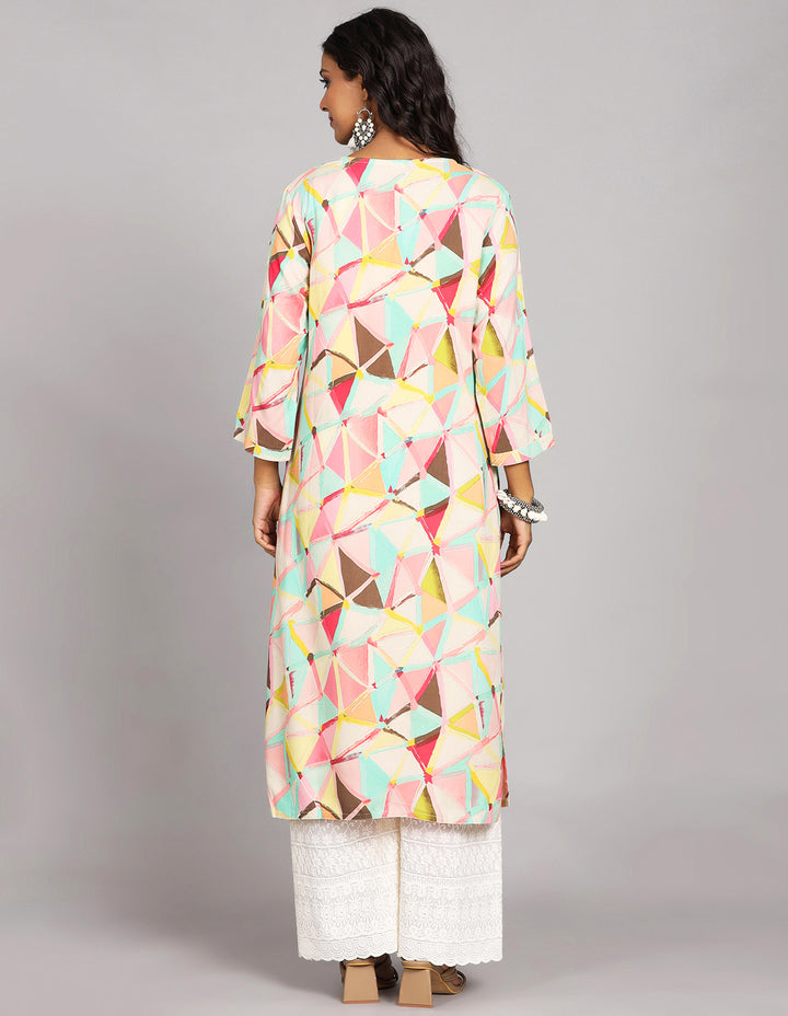 Woman showing the back view of a  Multicolor Printed Long Kurti with Round Neck Design and three-quarter sleeve, paired with white palazzo and brown heels, highlighting the relaxed fit and simple design from behind.