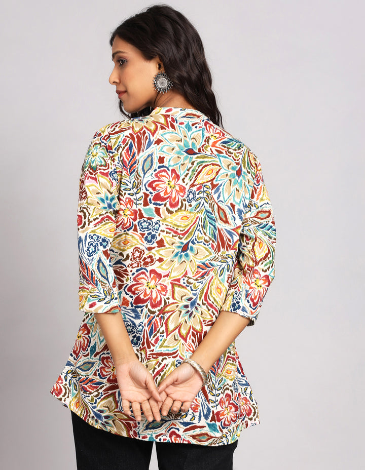 Woman showing the back view of a MultiColor Short Kurti with Collar Neck Line with slited three-quarter sleeve paired with black jeans and brown slipeers, highlighting the relaxed fit and simple design from behind.