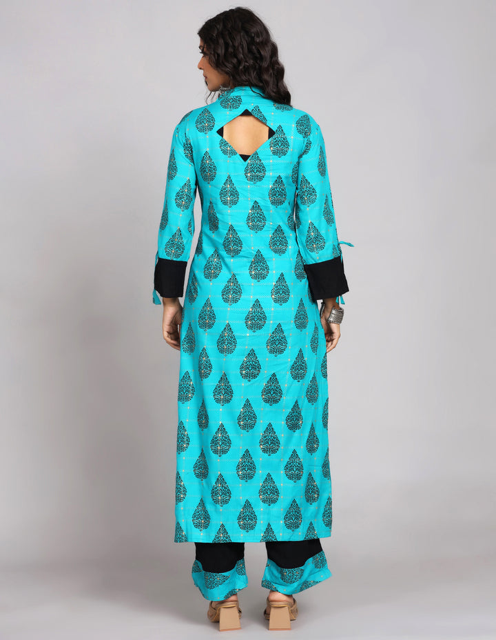 Woman showing the back view of a Printed Blue Color Cotton Knee Length Kurta with three-fourth sleeves paired with brown sandals, highlighting the relaxed fit and simple design from behind.