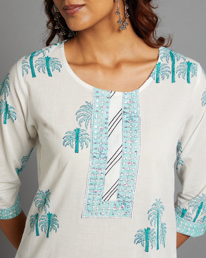 Close-up view of White Round Neck Hand Block Cotton Kurti, focusing on the fabric texture,Wodden Buttons, neckline and stitching details.
