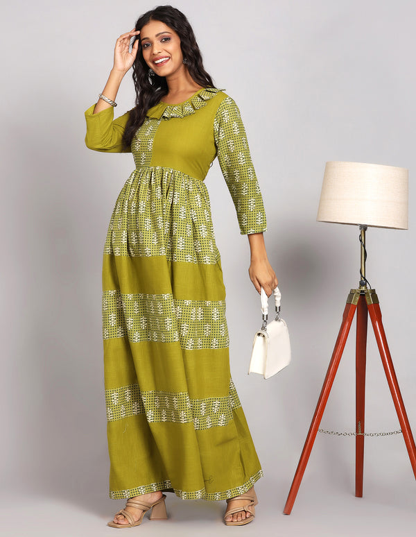 Stylish Printed Mehendi Green with Round Neck Long Kurti, paired with brown heels, worn by a woman standing next to a lamp with open hair and taking white handbag.