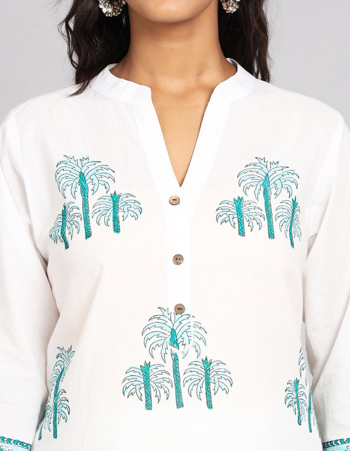 Close-up view of White Long Kurti With Hand Block Print, focusing on the fabric texture, Wooden Buttons, neckline and stitching details.