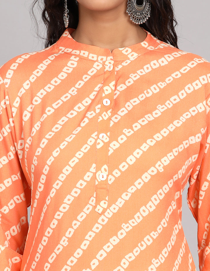 Close-up view of orange color printed long kurti , focusing on the fabric texture, wooden buttons, and stitching details.