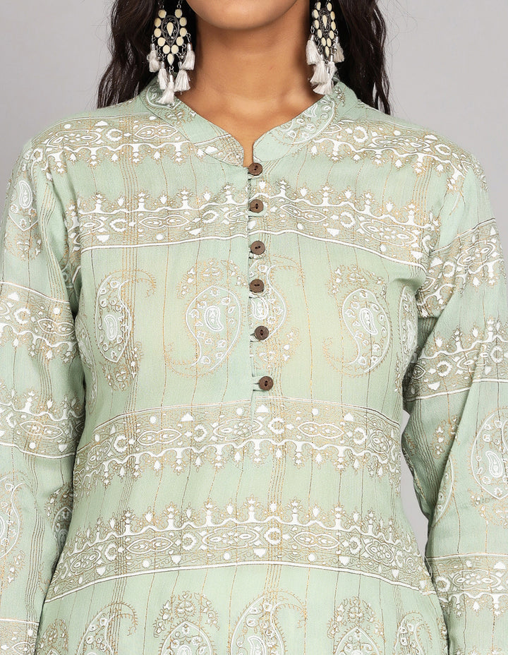 
Close-up view of Mint Green Long Kurti with collar neckline, focusing on the fabric texture, neckline, wooden Buttons and stitching details.
