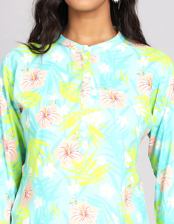 Close-up view of a Sky Blue Short Kurti wiht floral print, focusing on the fabric texture, neckline and stitching details.