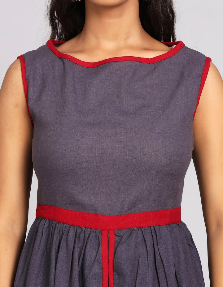  Close-up view of a solid lack charcoal color long kurti , focusing on the fabric texture, neckline and stitching details.