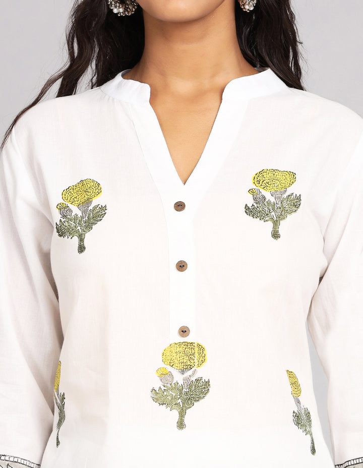 Close-up view of  White Long Kurti With Floral print and Collar neck Design, focusing on the fabric texture, neckline, buttons and stitching details.