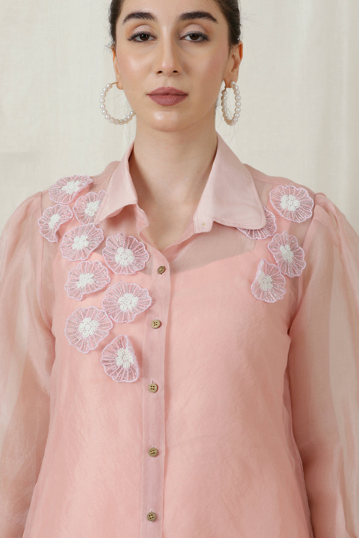 A close-up of the Bead Embroidered Collar Neck on the bubble gum pink top.