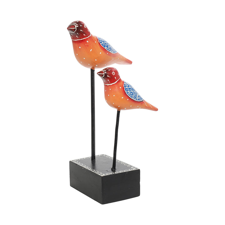 wooden bird pair figurine placed at iron rod