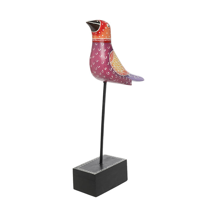 hand-painted wooden bird figurine at iron rod