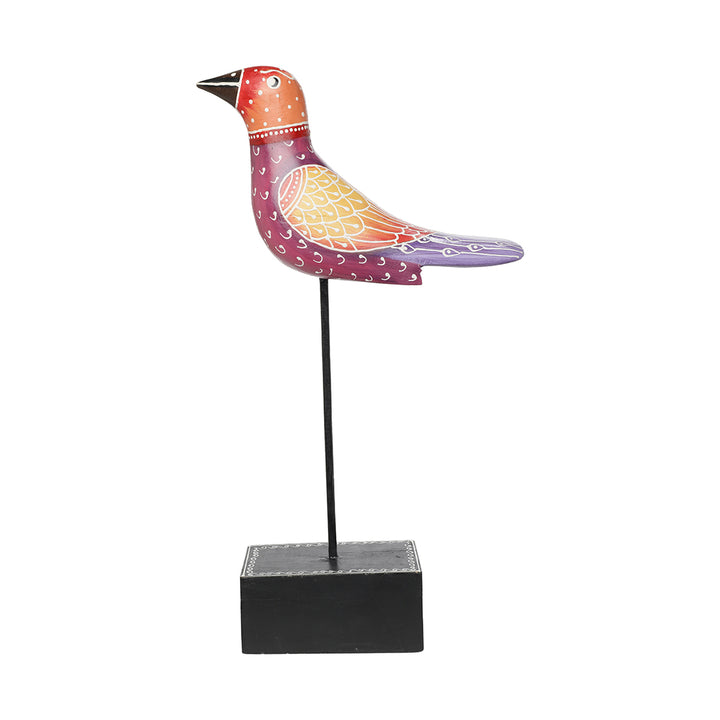 wooden bird figurine at iron rod table decor