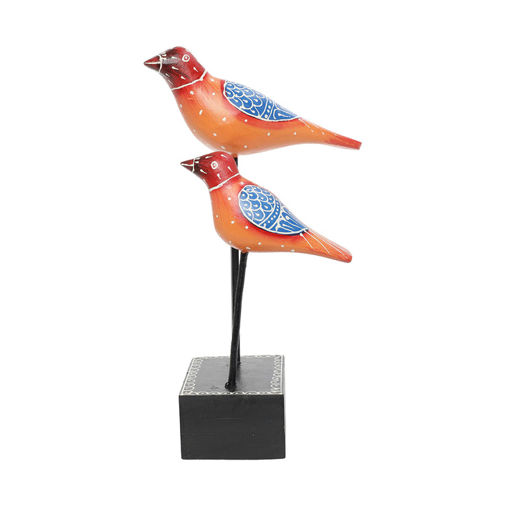 bird pair figurine placed at iron rod home decor