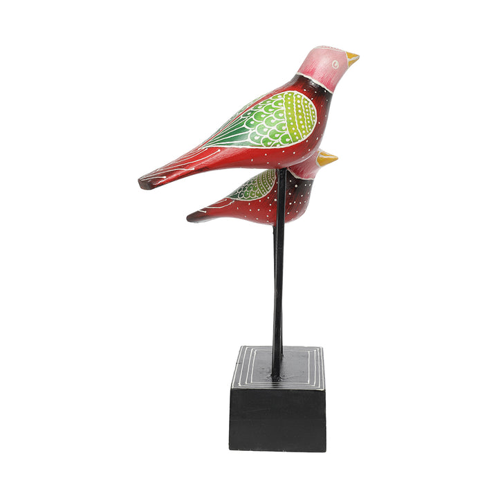 wooden bird pair figurine placed at iron rod home decor