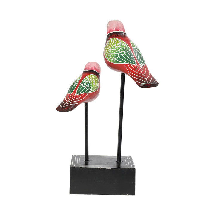 wooden bird pair figurine placed at iron rod table-decor